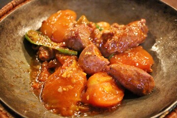 Afghan cuisine: mutton karahi with with tomatoes and shishito peppers
