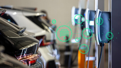 EV charger and electric car, Electric car charger station for charge ev battery, Plug for vehicle with electric engine, EV charger clean energy, Charging point at car parking lot department store.