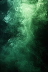 Obraz premium Swirling green smoke or mist forming abstract patterns against a dark background evoking a mysterious and ethereal atmosphere
