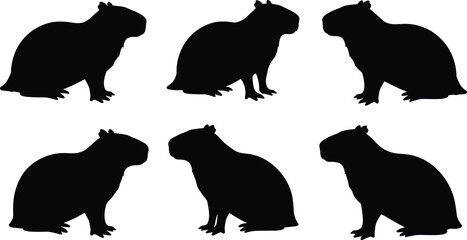 Black silhouette set of capybara in sitting position, isolated animal shapes collection, wildlife rodent outlines, vector illustration for design and art