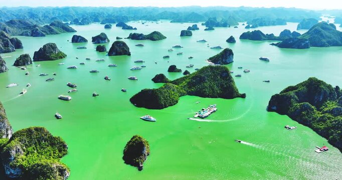 Aerial view of Scenic Halong Bay, Vietnam with boats amongst limestone islands. UNESCO World Heritage Site. Popular landmark, famous destination of Vietnam