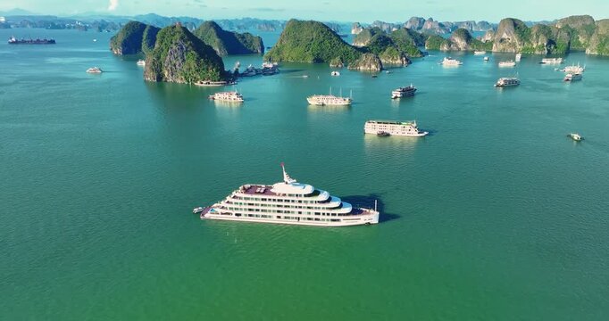 Aerial view of Scenic Halong Bay, Vietnam with boats, cruise among limestone islands. UNESCO World Heritage Site. Popular landmark, famous destination of Vietnam