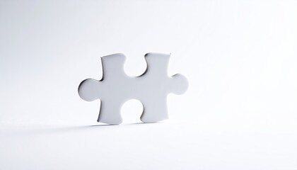 Obraz premium Single white jigsaw puzzle piece casting soft shadow