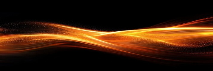 Flowing luminous golden light trails with sparkling particles over black background conveying energy and movement