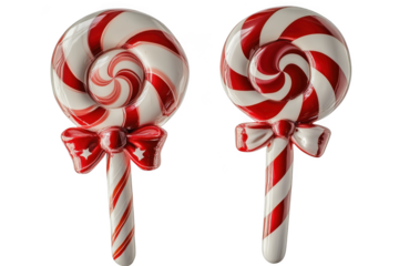 Two festive red and white striped lollipops with bows, holiday candy treats, christmas decorations, sweet confections isolated on transparent background