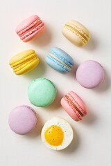 Obraz premium Assortment of Colorful French Macarons on White Background