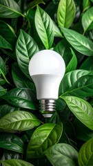 LED bulb surrounded by lush green leaves