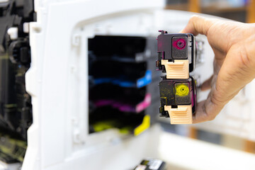 Technician Holding ink printer toner low for replace new or fix repair problem paper or print...