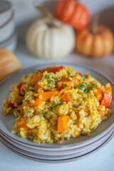 home made Pumpkin risotto on a rustic table