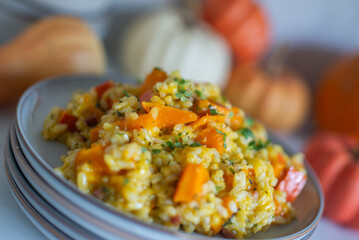 home made Pumpkin risotto on a rustic table