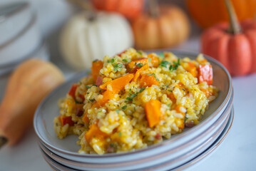 home made Pumpkin risotto on a rustic table