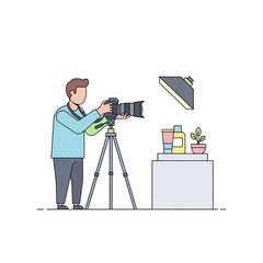 Creative photographer in a studio taking pictures of cosmetic products