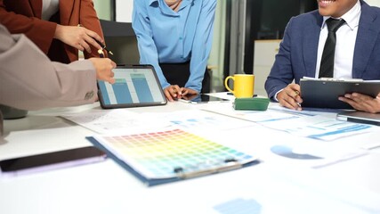 Teamwork process, Business team using a calculator to calculate the numbers of statistic business profits growth rate on documents graph data, desk in the office. - Powered by Adobe