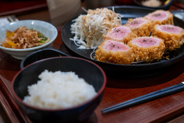 Sous vide pork katsu. Tonkatsu, Fried Pork with rice and vegetable set serve on plate in restaurant