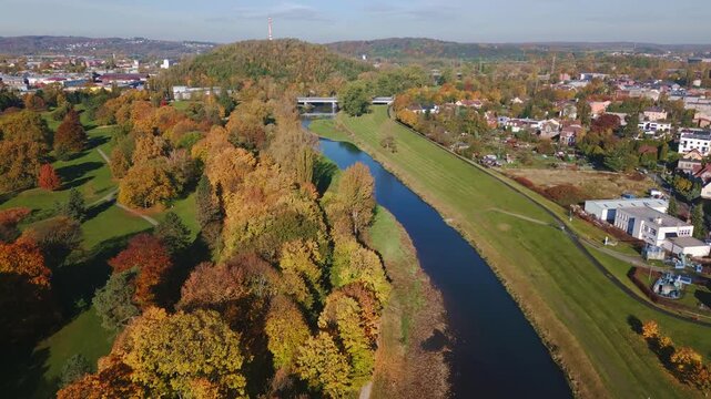 Komensky city Park golden autumn trees along River Ostravice Aerial