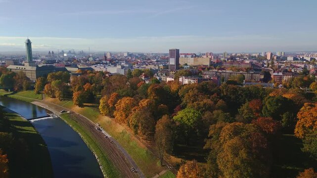 City skyline over Komensky park and River Ostravice in autumn colour