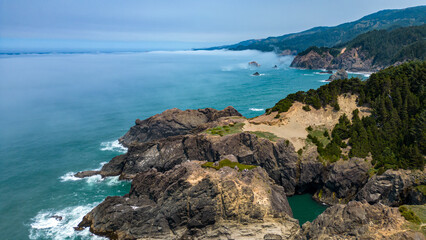 Fototapeta premium Aerial photo of Oregon rocky coast along Samuel H Boardman sceni corridor