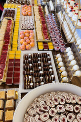 Upclose top to down photos of various sweets at a wedding banquet table