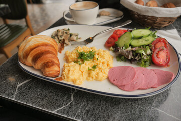 Delicious breakfast plate with fresh ingredients and coffee