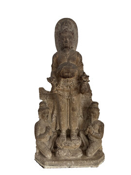 Ancient Javanese wealth deity statue (Kubera/Jambhala), standing with a treasure bag and bowl, flanked by kneeling supplicants. This piece reflects the prosperity and devotional aspects of classical I