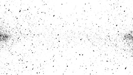Black speckles scattered across white background dots spots