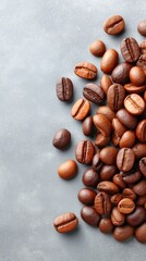 Obraz premium A Styled Flat Lay of Richly Roasted Coffee Beans Scattered Across a Textured Gray Background With Soft Lighting and a Detailed Close Up View