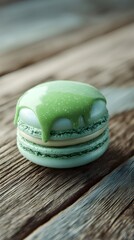 Close-up of a Green Macaron with Glaze Drip on Wood