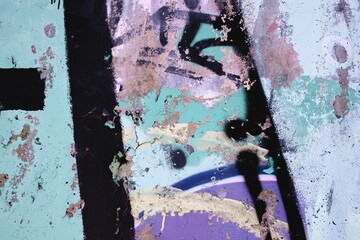 Urban grunge wall with faded graffiti in pastel hues. Textured decay, retro 90s vibe, abstract patterns. Street art, urban photography, creative backdrop, modern 90s, Y2K visuals.