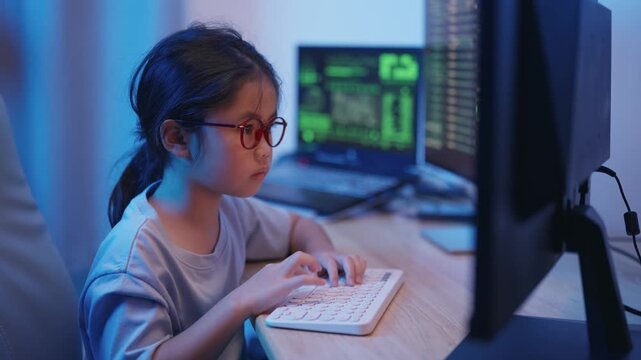 Focused Young Girl Engaged in Coding and Programming at Home with Computers and Monitors, Illuminated by Soft Blue Lighting in a Modern Workspace