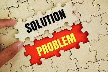 Wooden puzzle with the word problem covered with a solution. concept of solving a problem or finding a solution. symbolizes finding answers, clarity, or solutions among uncertainty.