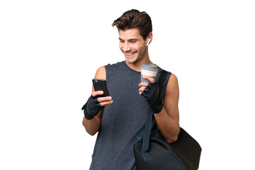 Young sport caucasian man with sport bag over over isolated background holding coffee to take away...