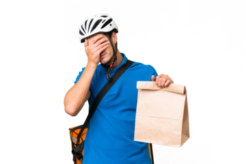 Young caucasian man taking a bag of takeaway food over isolated background with tired and sick expression