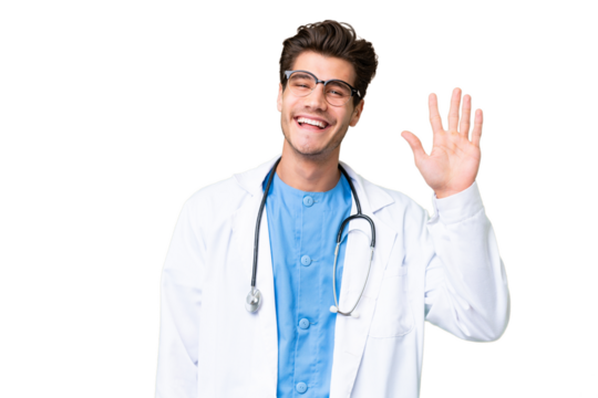 Young doctor man over isolated background saluting with hand with happy expression