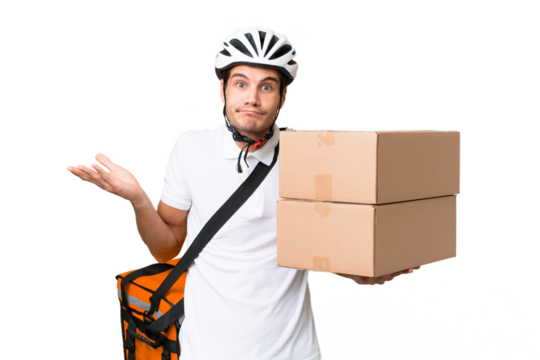 Delivery man wearing a helmet bike over isolated background having doubts while raising hands