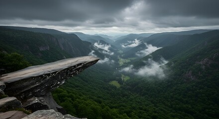 Dramatic Mountain Vista with Misty Valley and Overcast Sky