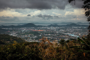 Beautiful nature, mountains and forest. Cloudy sky.