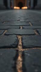 Cobblestone street perspective leading to blurred lights creating a sense of depth and urban exploration at night with a vintage feel and texture