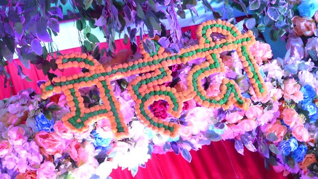 Vibrant mehendi Ceremony Setup with Floral Decorations Backdrop