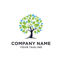 Obraz premium A vibrant logo featuring a tree with a full crown of green and blue leaves, with a dark trunk.