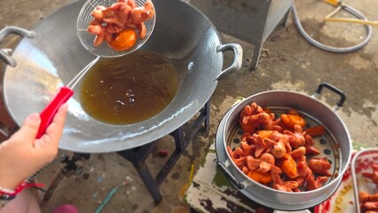 Cooking Process of Delicious Fried Snacks in a Traditional Kitchen Setting