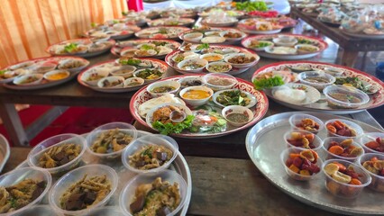 Abundant Array of Traditional Dishes Displayed on Tables at Festive Food Market Event