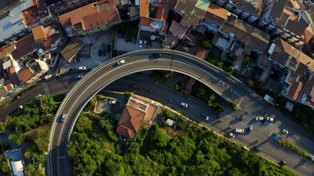 Aerial view of winding roads in Vietri sul Mare at sunset with urban landscape