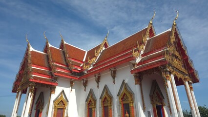 Stunning Traditional Thai Temple Architecture with Colorful Roof and Intricate Details