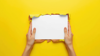 Transparent hands holding a blank white paper sheet through a torn yellow paper background, copy space for text mockup