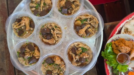 Traditional Asian Dish with Meat and Jelly-like Blocks in Small Portions on a Serving Tray