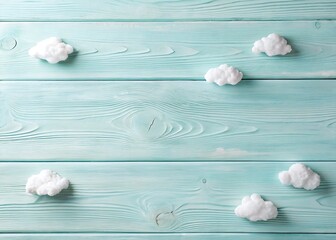 Soft white meringue clouds scattered across a rustic light blue wooden background