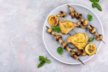 Tuna fish roasted with mushrooms on skewers.