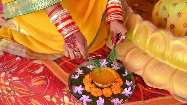 Closeup of bride hand during haldi ceremony in an Indian wedding