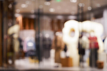 Abstract blur clothing boutique display interior of shopping mall background. blurred image background with clothing store.