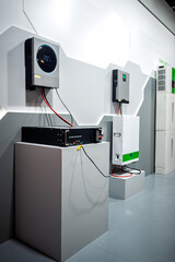 Modern LiFePO4 battery energy storage system with hybrid inverter and power converters. Sustainable technology for residential and commercial solar energy solutions. © dizfoto1973